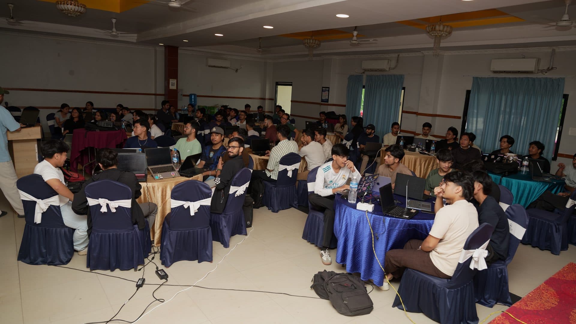 Attendees networking at a tech meetup
